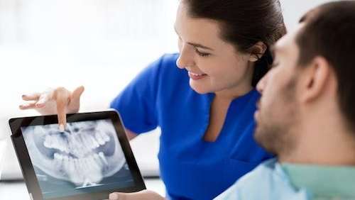 A Root Canals patient being shown their xray in Royal Oak, MI