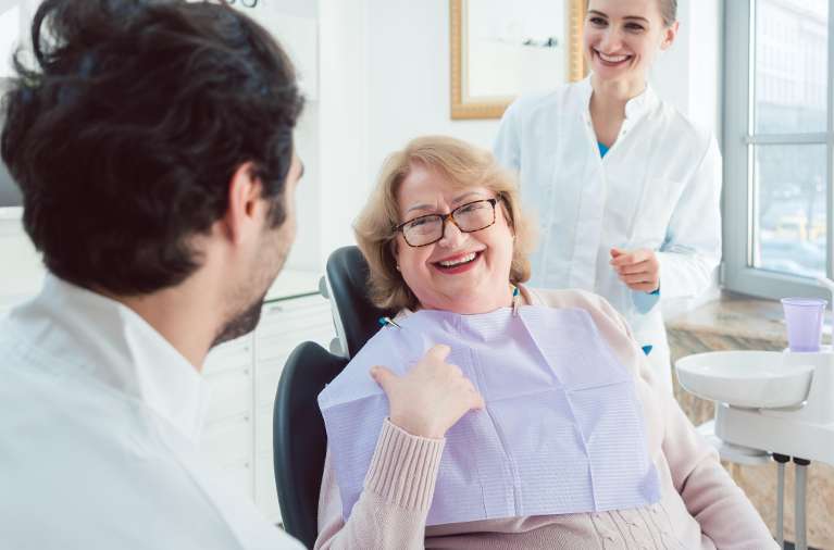 an elderly lady getting ready for a Root Canal treatment in Royal Oak, MI