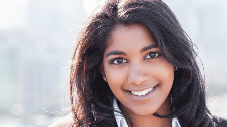 a beautiful woman with after Family Dentistry in Royal Oak, MI