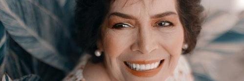 Elderly lady smiling after getting dentures from Family Dentistry of Royal Oak