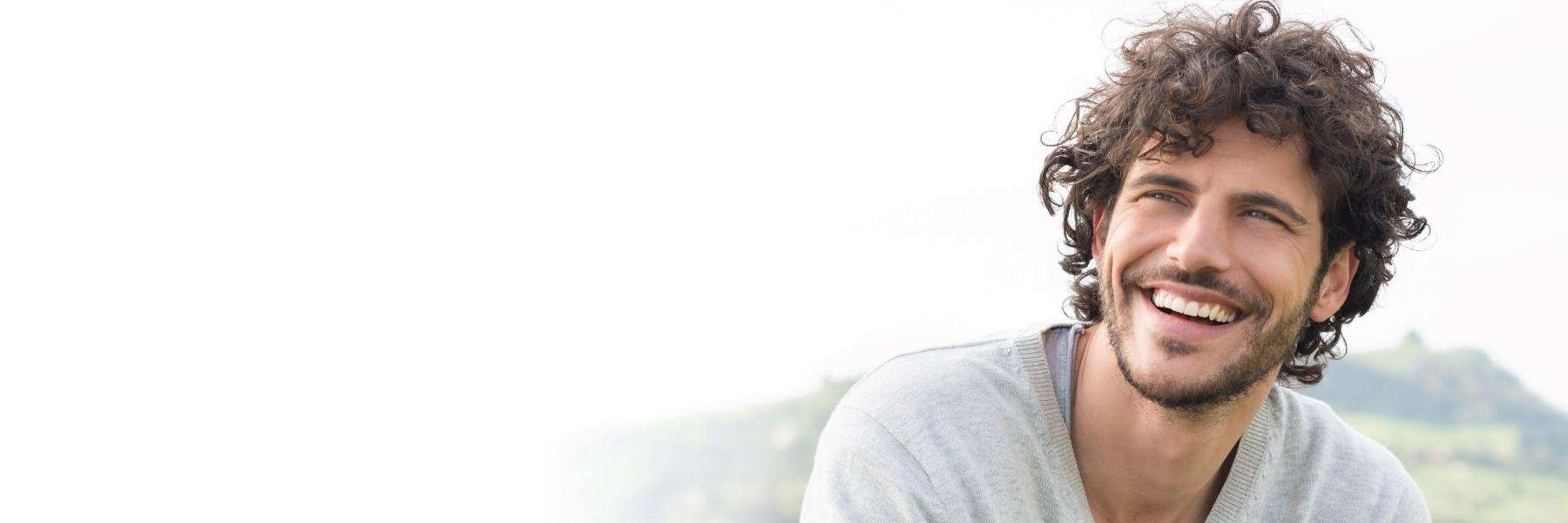 a handsome man after Family Dentistry in Royal Oak, MI