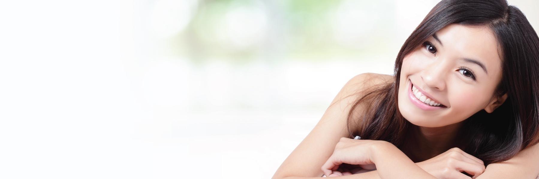 Woman smiles I Dental implants royal oak MI