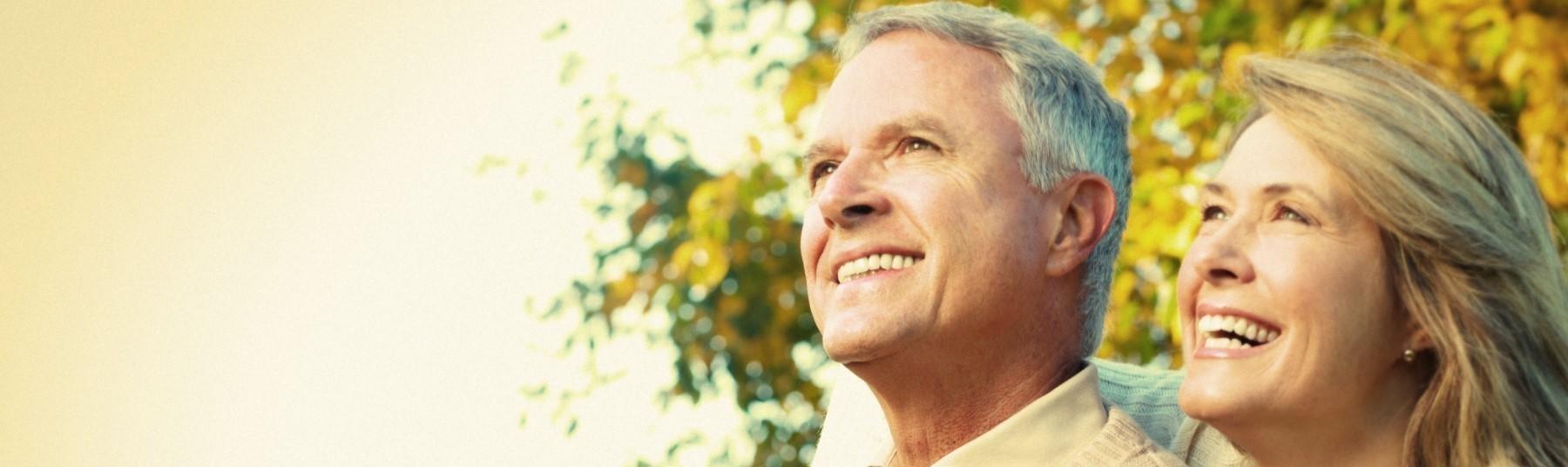 Older couple together smiling Dentures royal oak MI