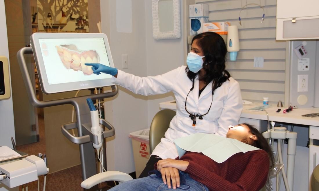 Dr. Chalasani with patient in Family Dentistry of Royal Oak